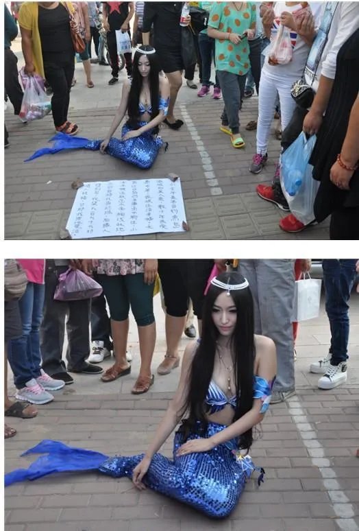 钓鱼岛蓝色美人鱼惊现街头 称收集情人祝福